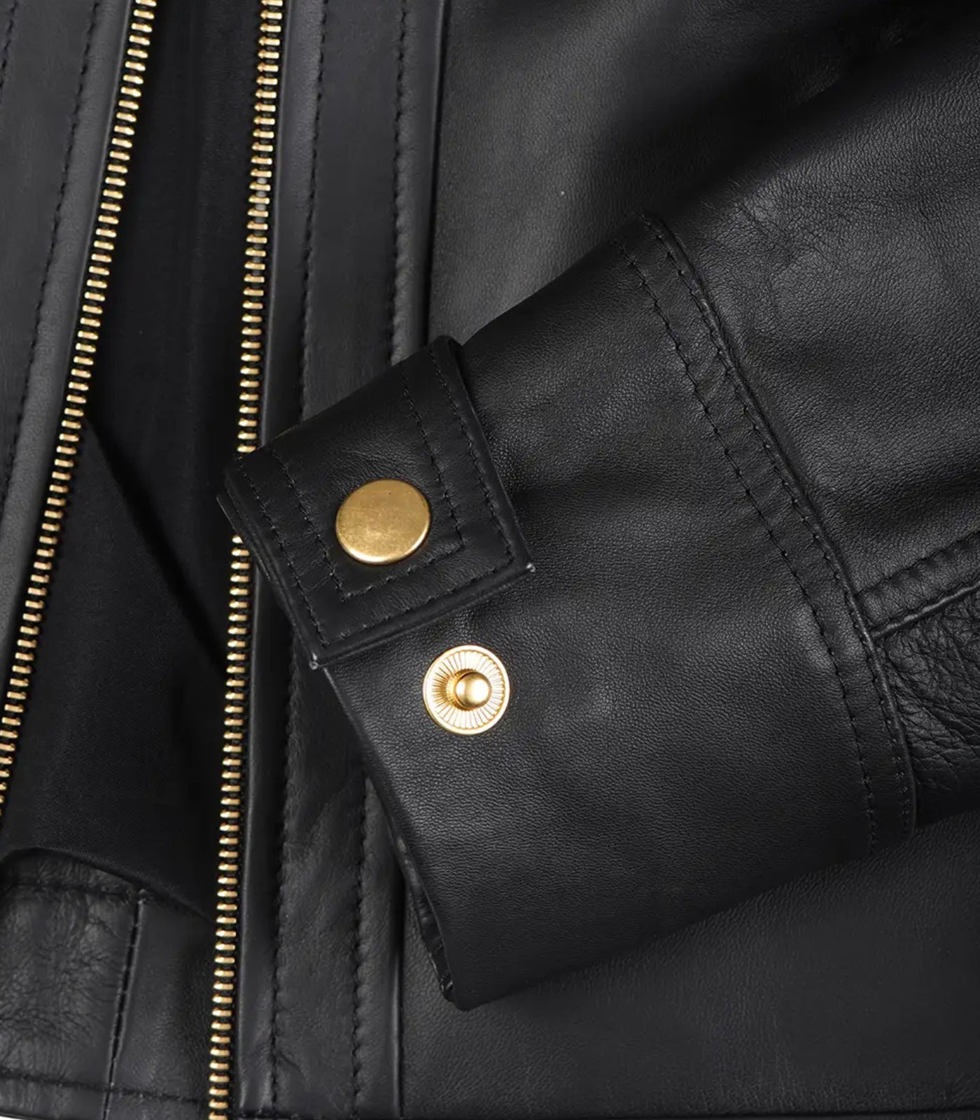 Women’s genuine black leather moto-style jacket with gold accents