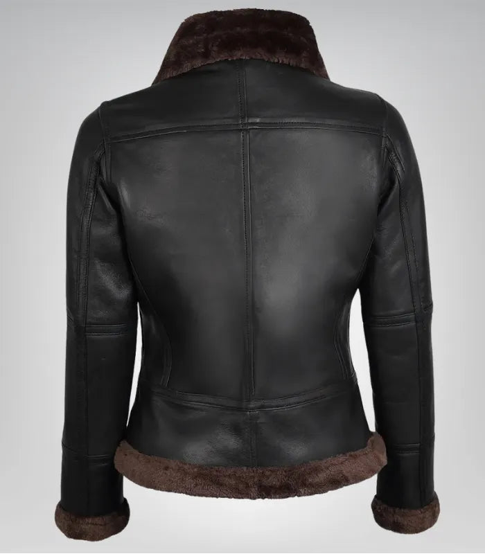 Alt Text: Cozy dark brown leather bomber jacket with shearling lining for women